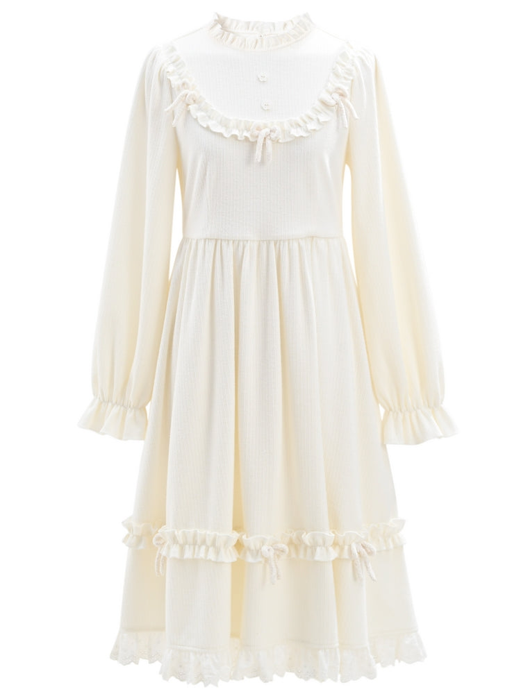 Robe à manches longues et col à volants avec nœud blanc