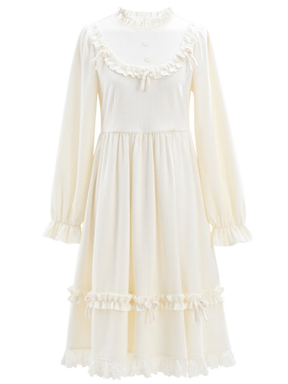 Robe à manches longues et col à volants avec nœud blanc