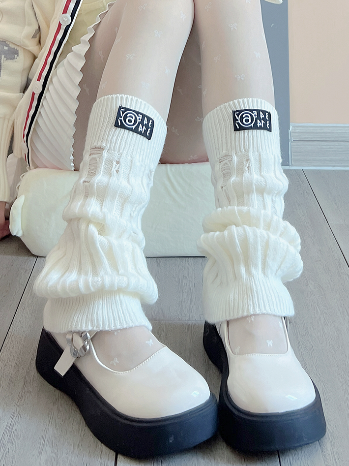 Jambières tricotées blanc cassé/noir